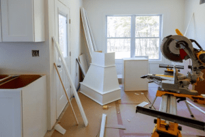 a room with a woodworking machine and a white box