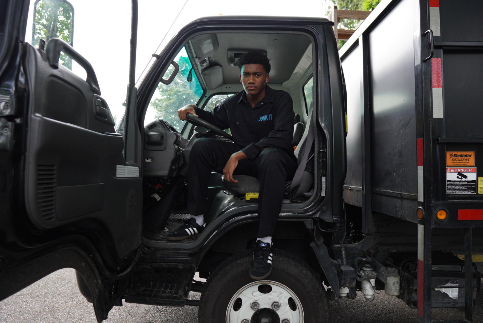a man sitting in the driver's seat of a truck
